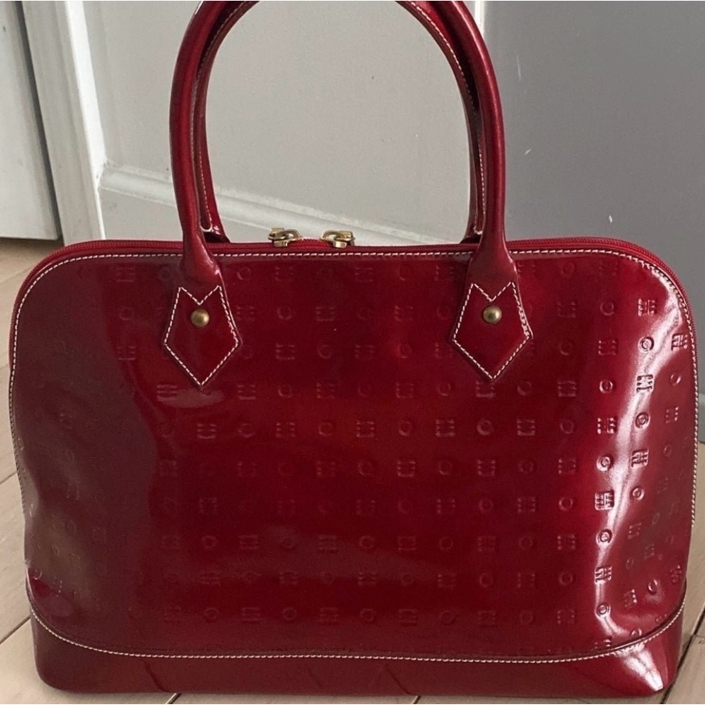 Arcadia Elegant burgundy handbag. Gold hardware Great conditiion